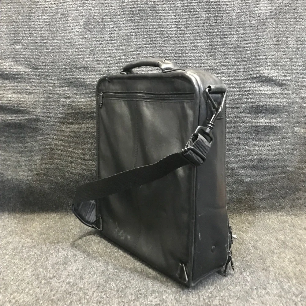 Tumi black leather