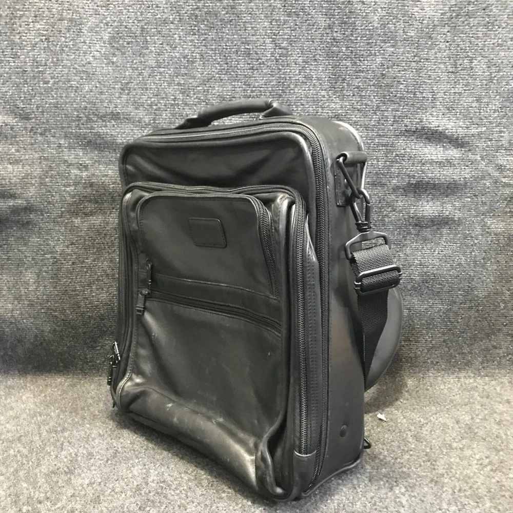 Tumi black leather