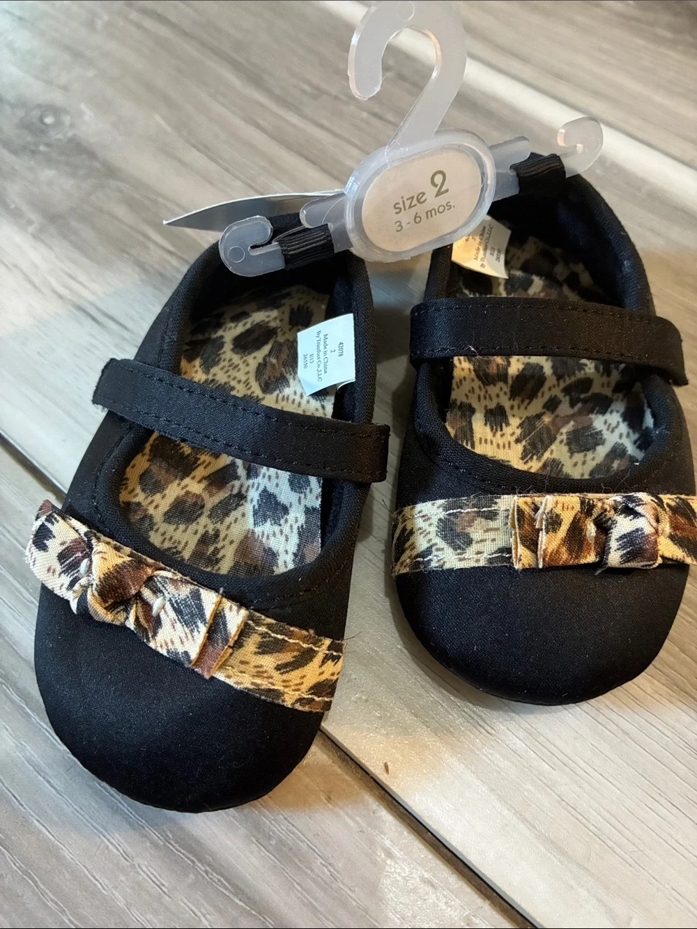 🖍️ First Impressions Black Baby Mary Jane Shoes with Leopard Bow