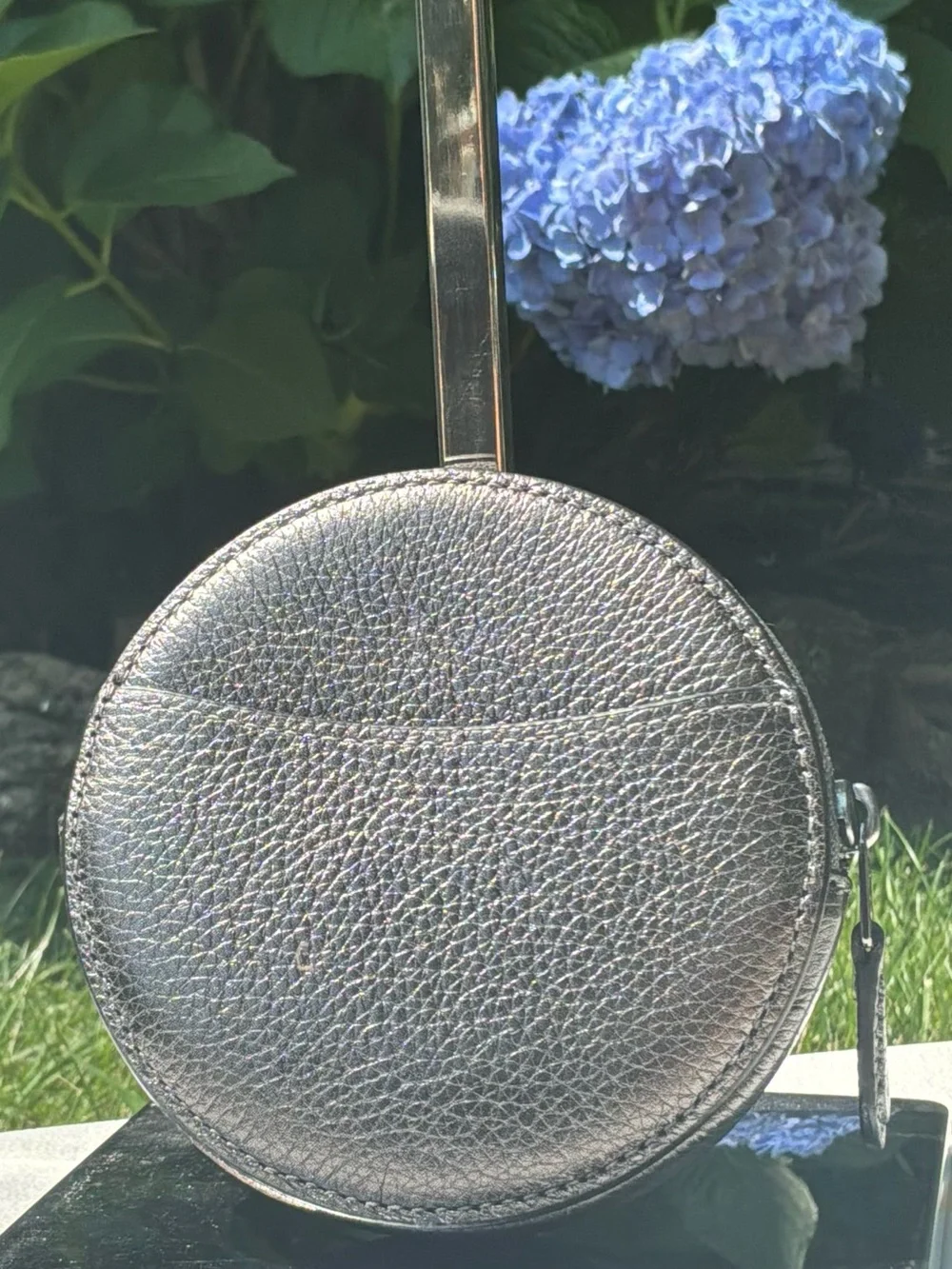 COACH Metallic Silver Gray Round case.