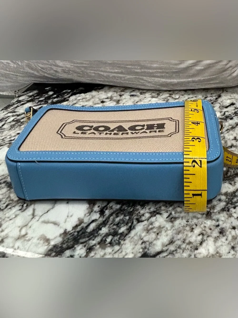 Coach branded canvas