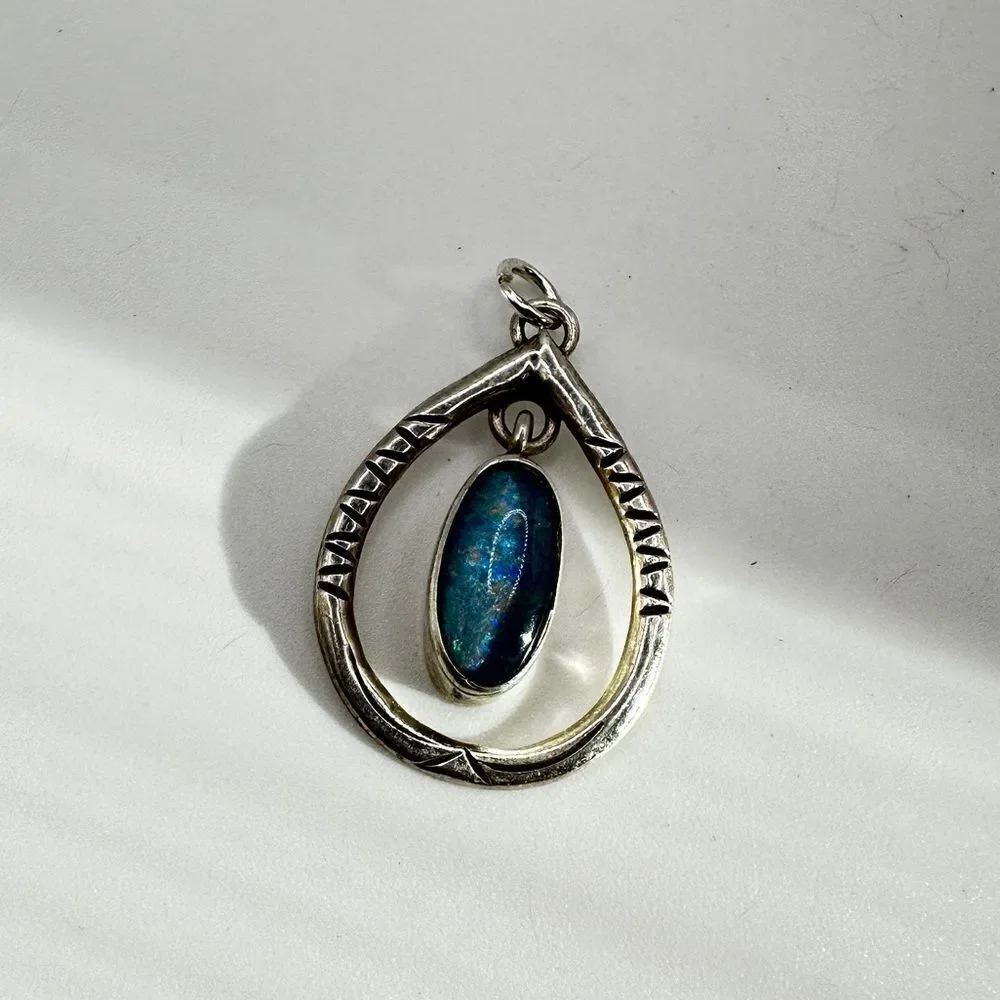 Marked Sterling‎ silver (HTS) and opal in resin pendant!