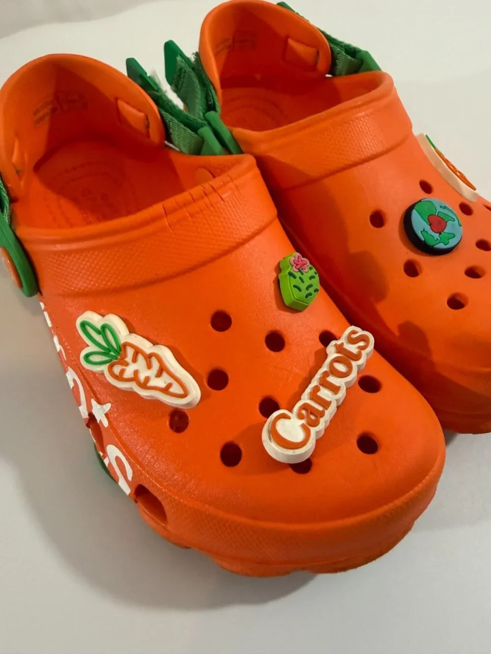 Crocs Carrots clogs with green straps & Croc charms size 1 Junior- gently used