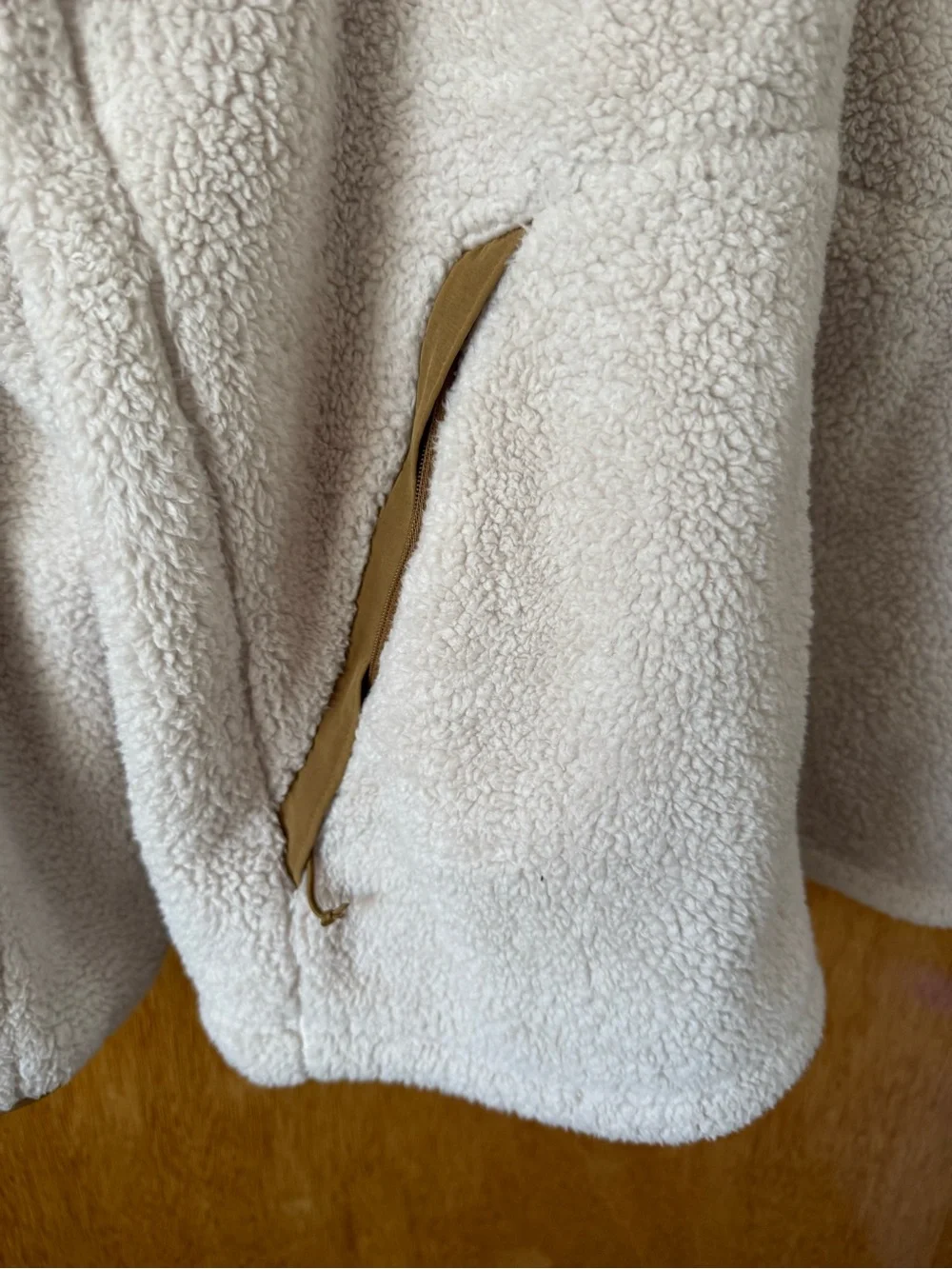 The North Face plush cream