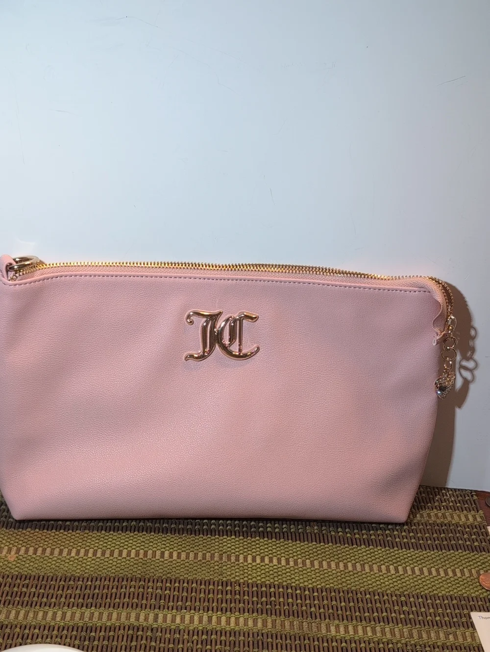 Juicy Couture Light Pink Vegan Leather Clutch Bag With Gold Hardware.