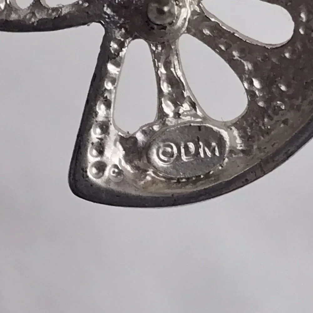 DM pin brooch