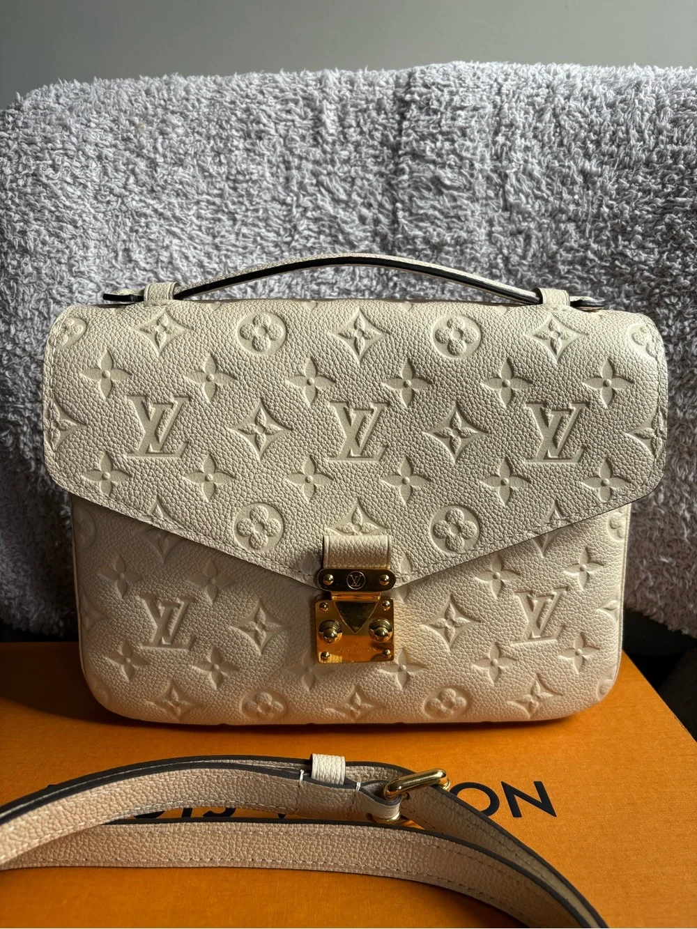 Louis Vuitton Empreinte Pochette Métis in cream