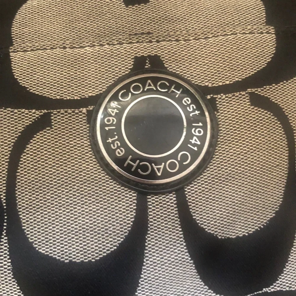 Coach signature fabric