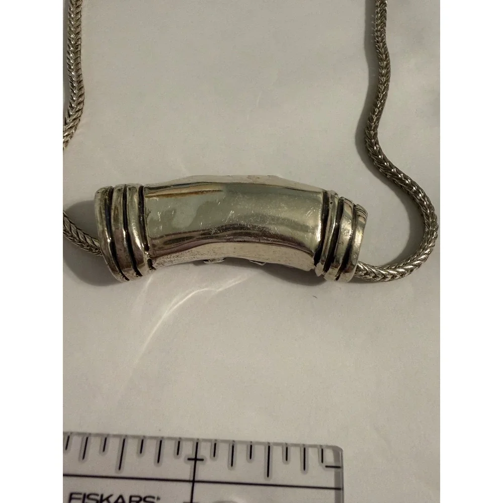 Unbranded ornate silver