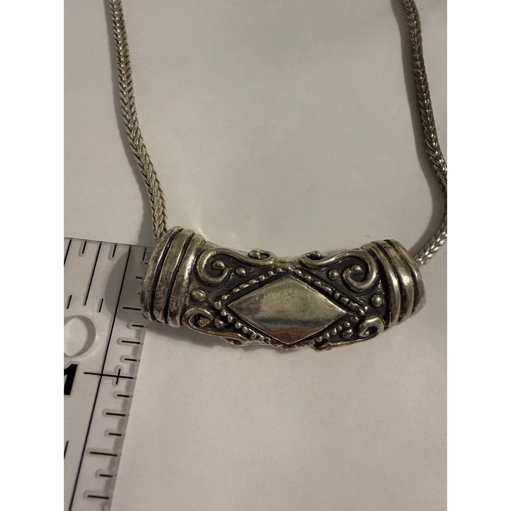 Unbranded ornate silver