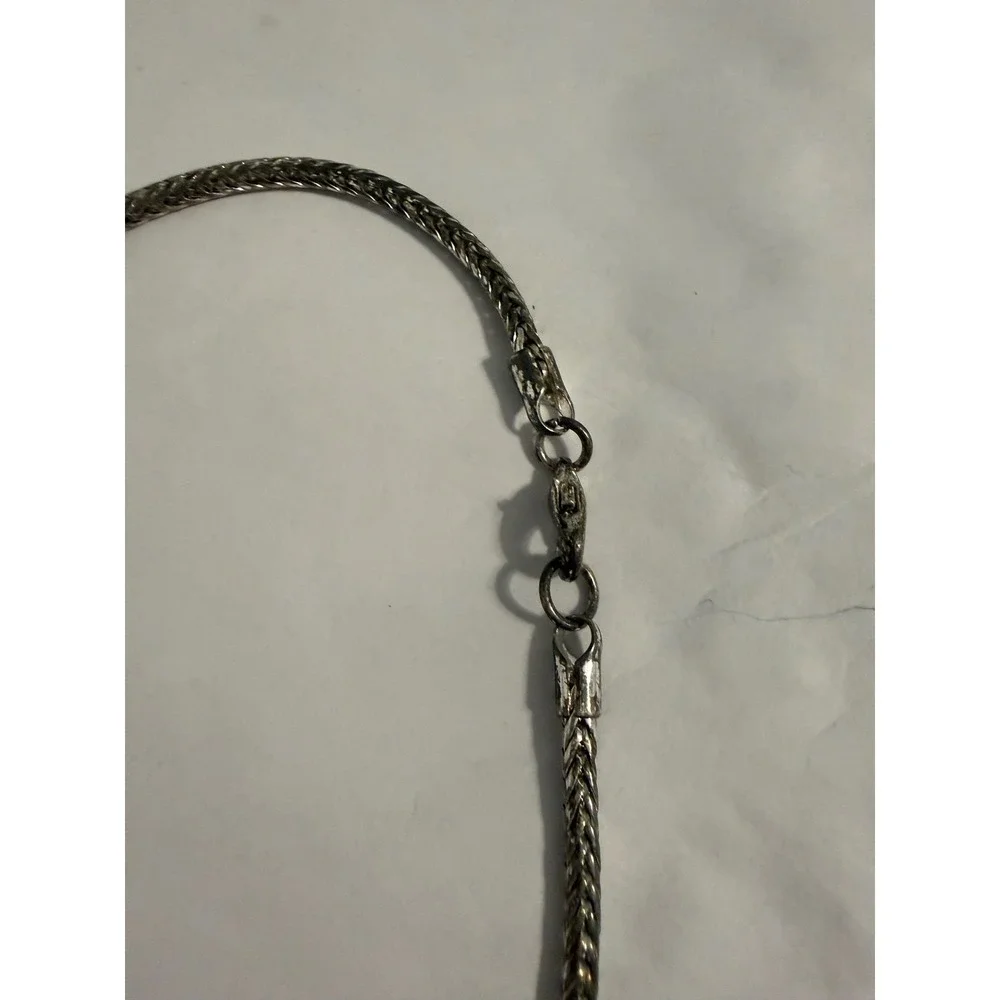 Unbranded ornate silver