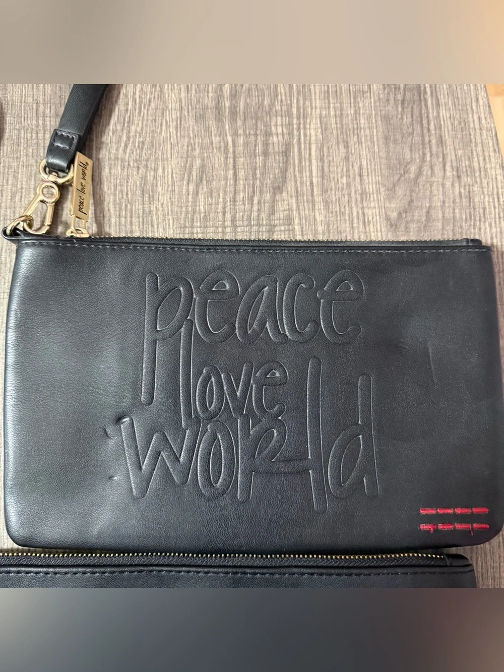 Peace Love World black embossed