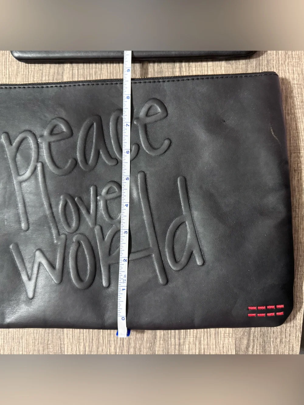 Peace Love World black embossed