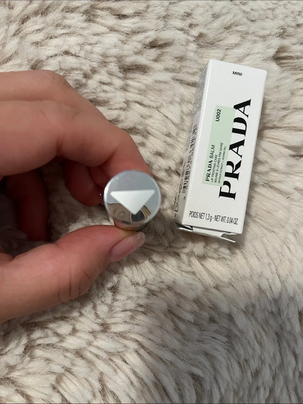 Prada hand once into
