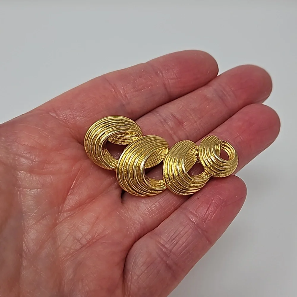 Avon gold tone