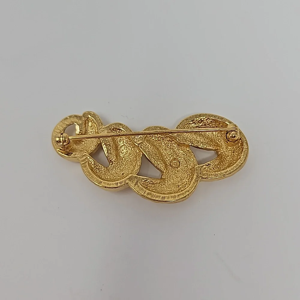 Avon gold tone