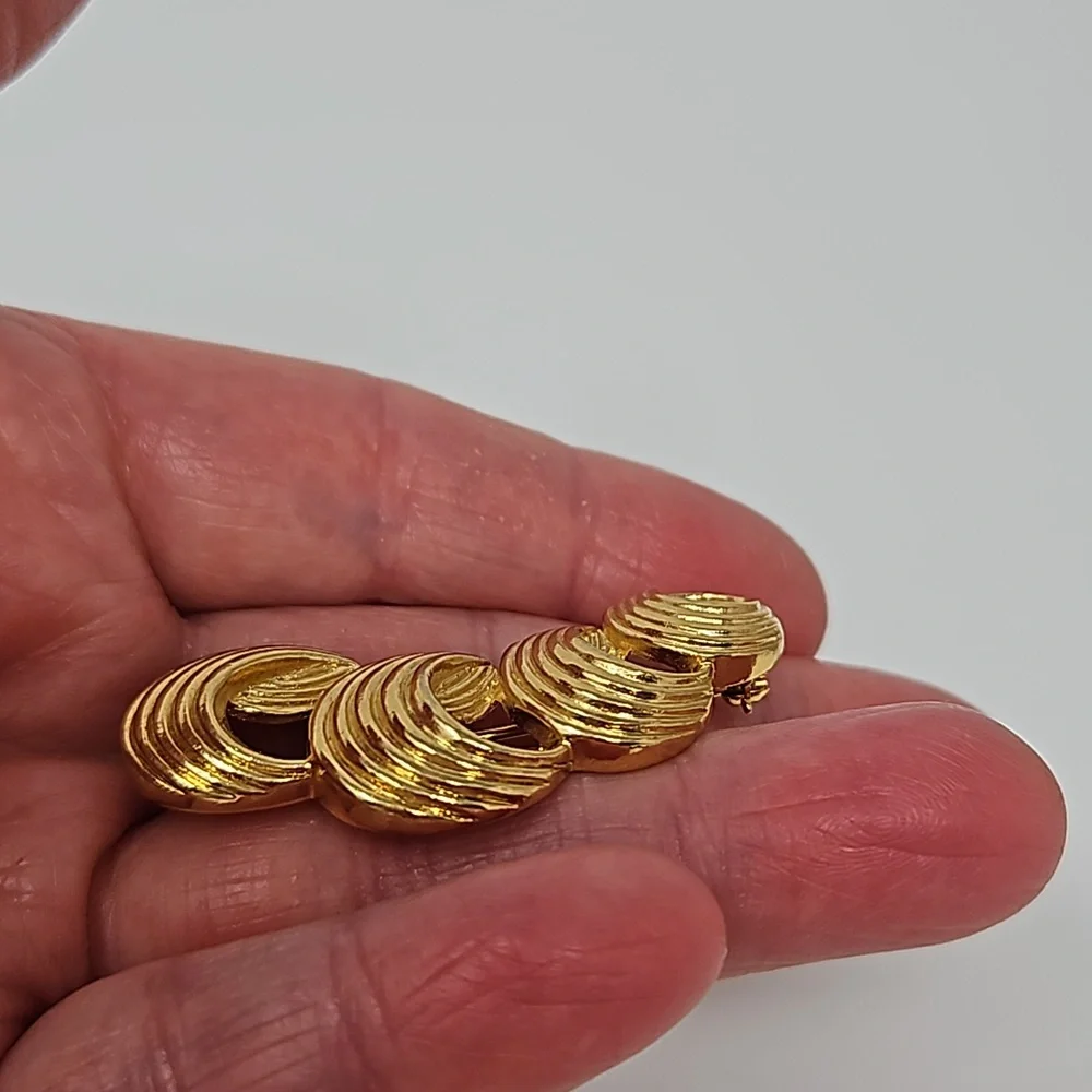 Avon gold tone