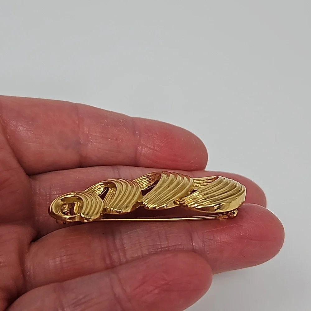 Avon gold tone