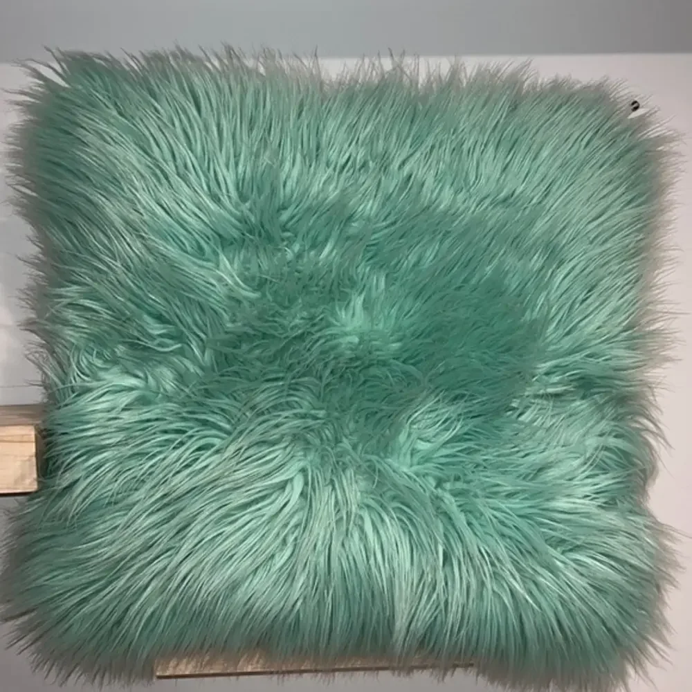 Teal fluffy accent‎ pillow
