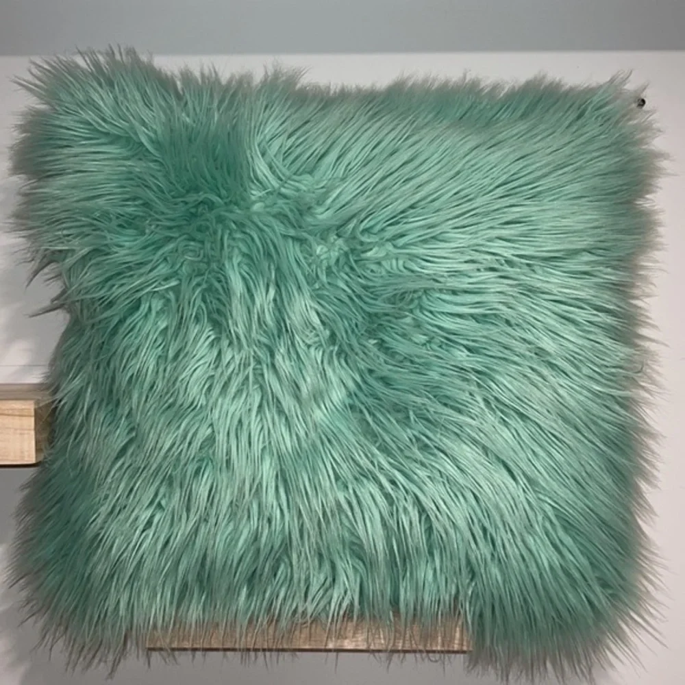 Teal fluffy accent‎ pillow