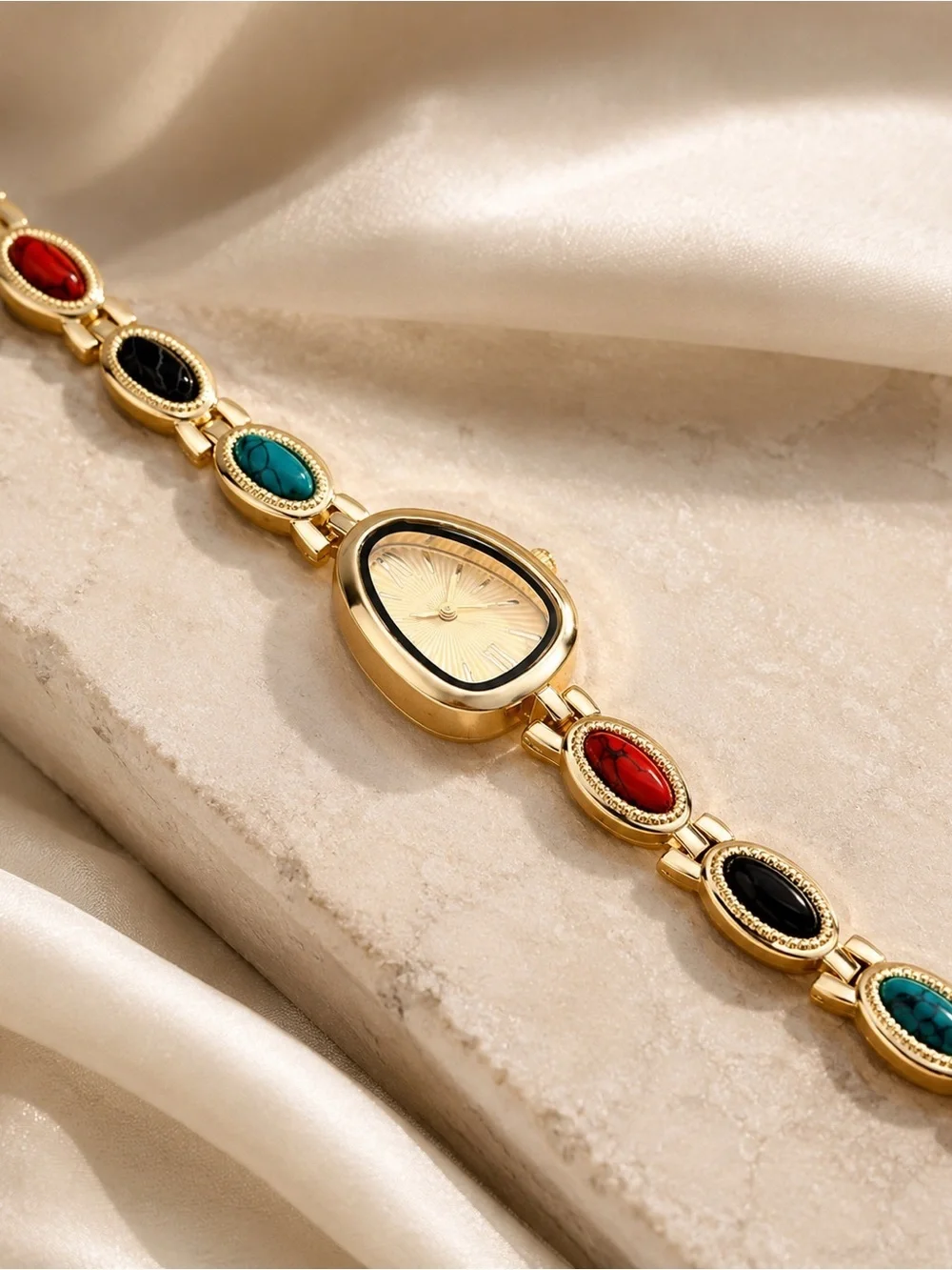 Gold Teardrop Dial Bracelet Watch with Red, Black and Turquoise Accents