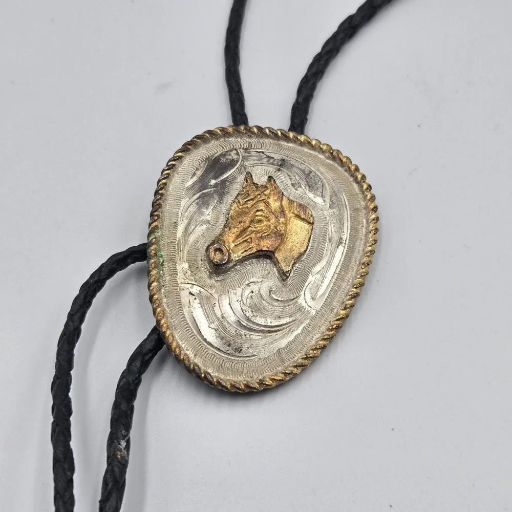 Vtg Southwestern Bolo Tie Silver Gold Tone Horse Head Black Braided Cord‎