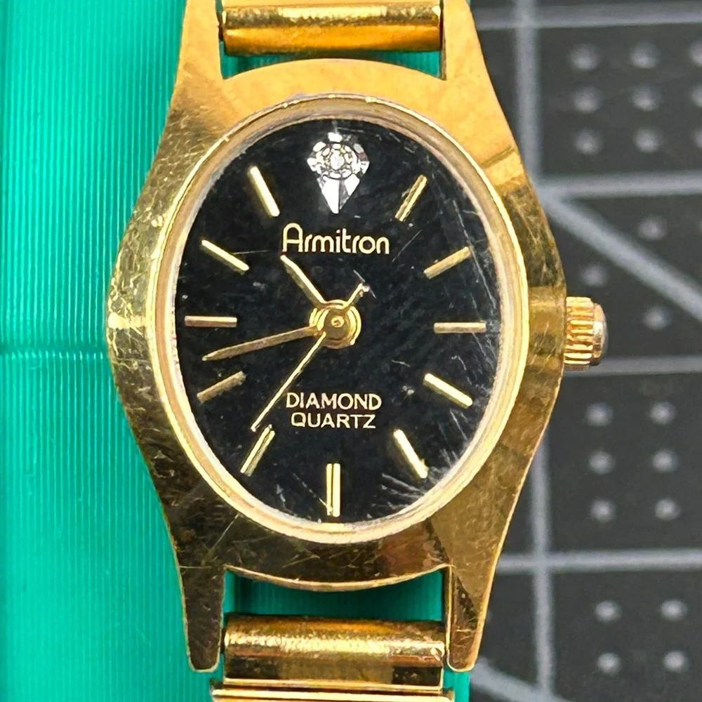 Armitron Diamond Quartz Womens Watch Gold Tone Black Dial Oval 25/5116‎ 400/101