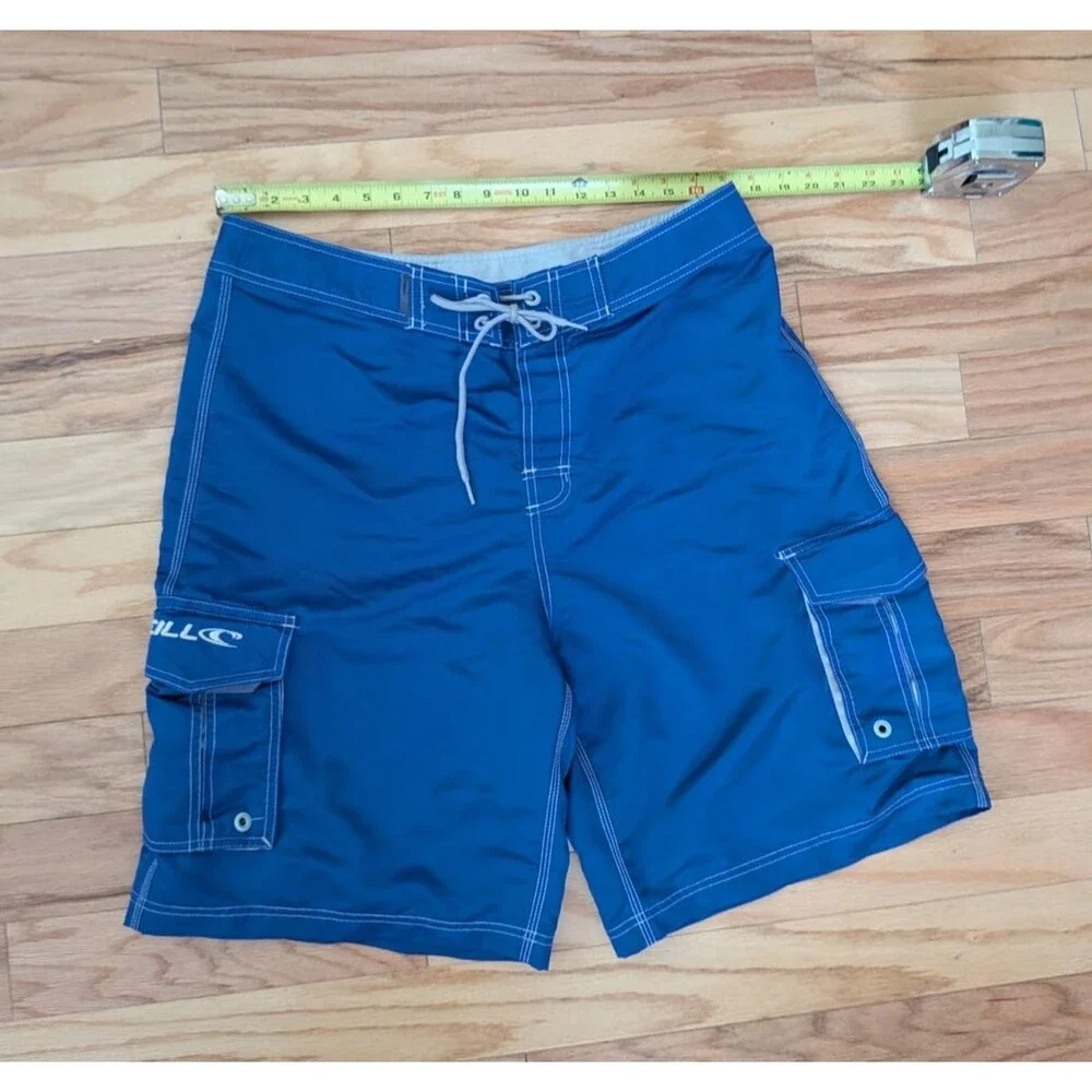 Vintage O'Neill Boardshorts Blue White Cargo Pockets Shiny Surf Wax Comb Size 34