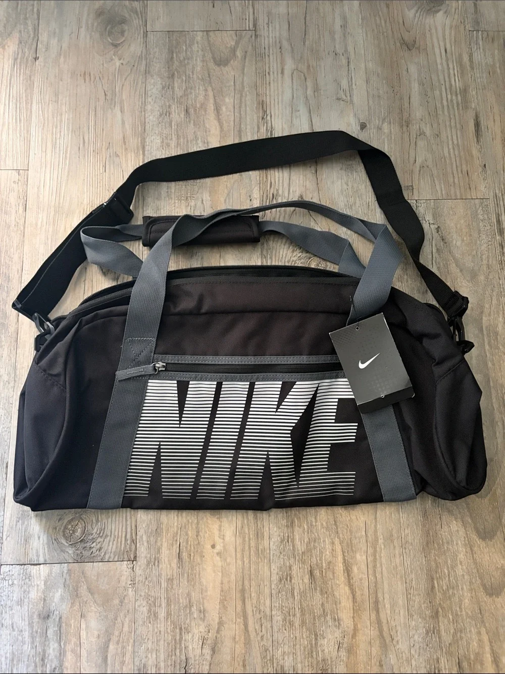 Nike Black Duffel Bag with Gray Straps and White Logo