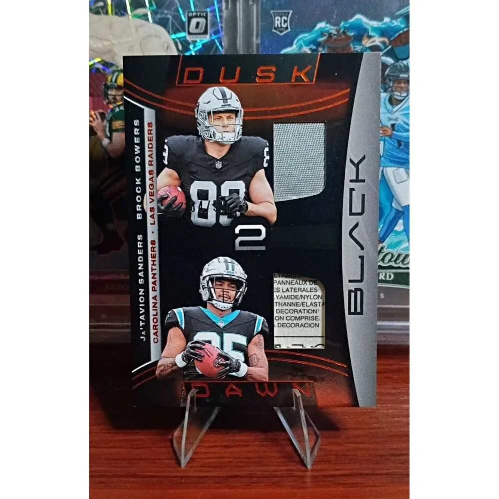 2024 Panini Black - Dusk 2 Dawn Brock Bowers, Ja'Tavion Sanders Laundry Tag