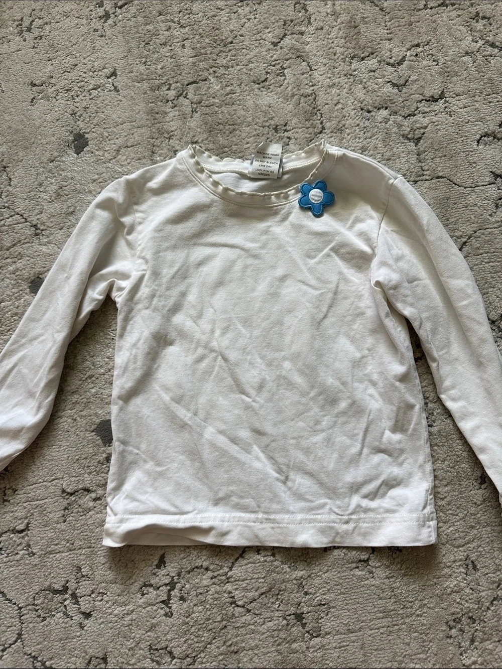 White Long-Sleeve Kids Top with Blue Flower‎ Accent