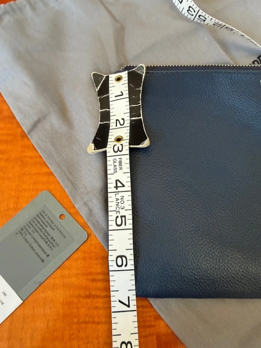 Zadig & Voltaire Navy Pebbled Leather Wristlet with Silver Wing Logo