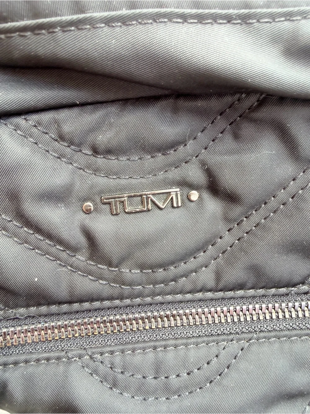 Tumi sleek quilted