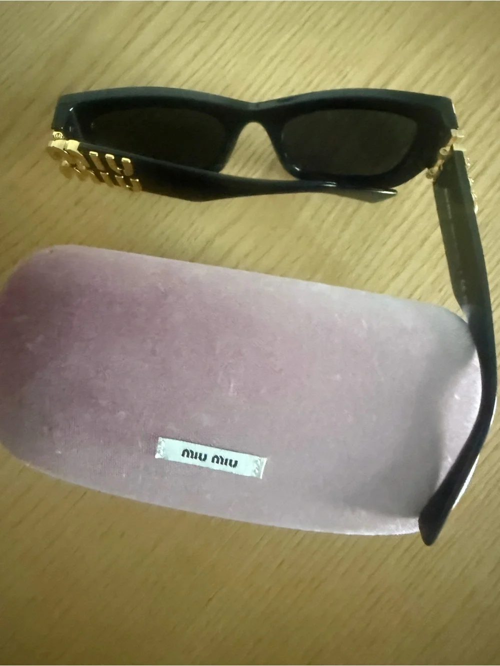 Miu Miu Black Sunglasses with Gold Logo Temples and Pink Velvet Case