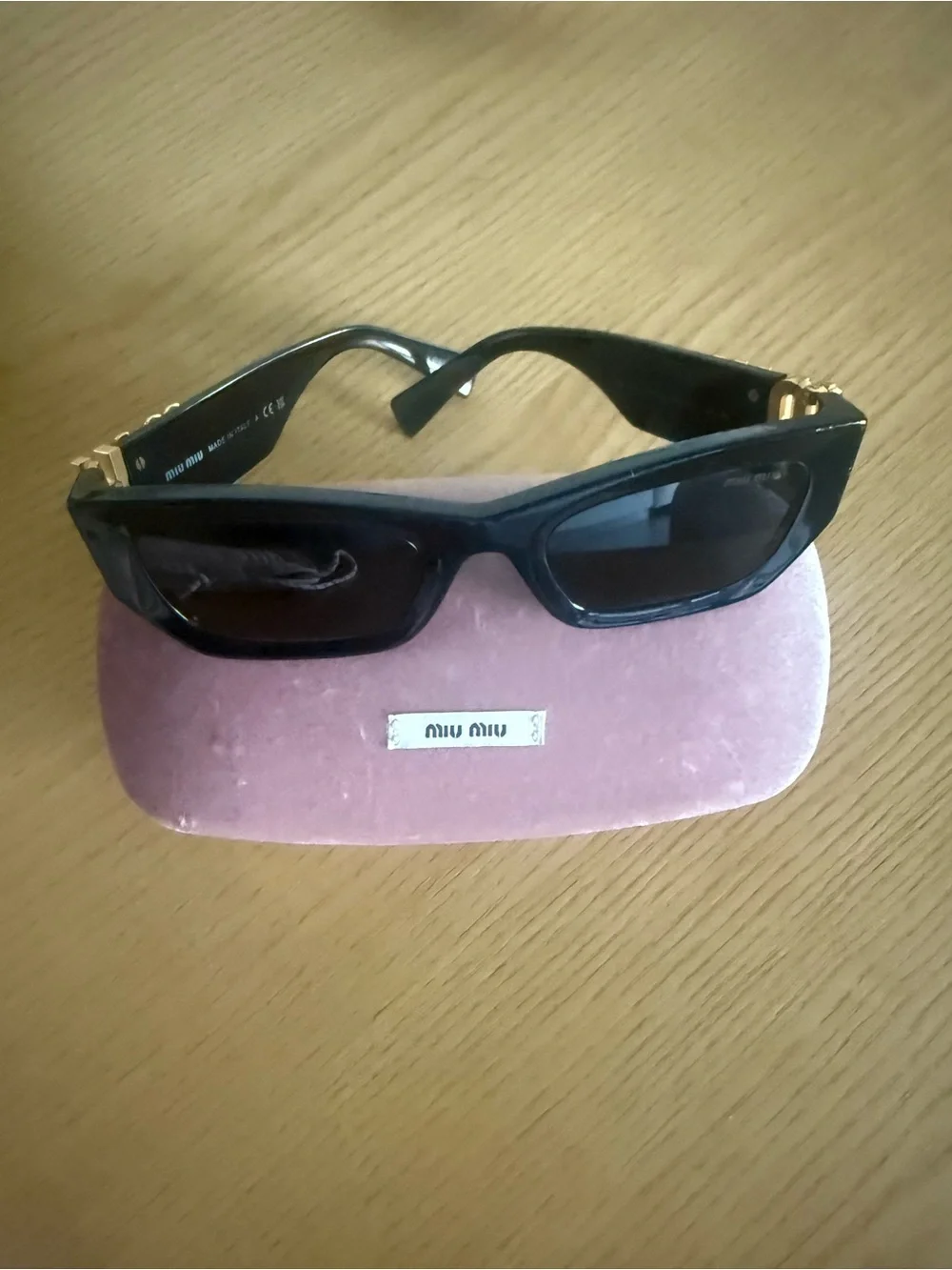 Miu Miu Black Sunglasses with Gold Logo Temples and Pink Velvet Case