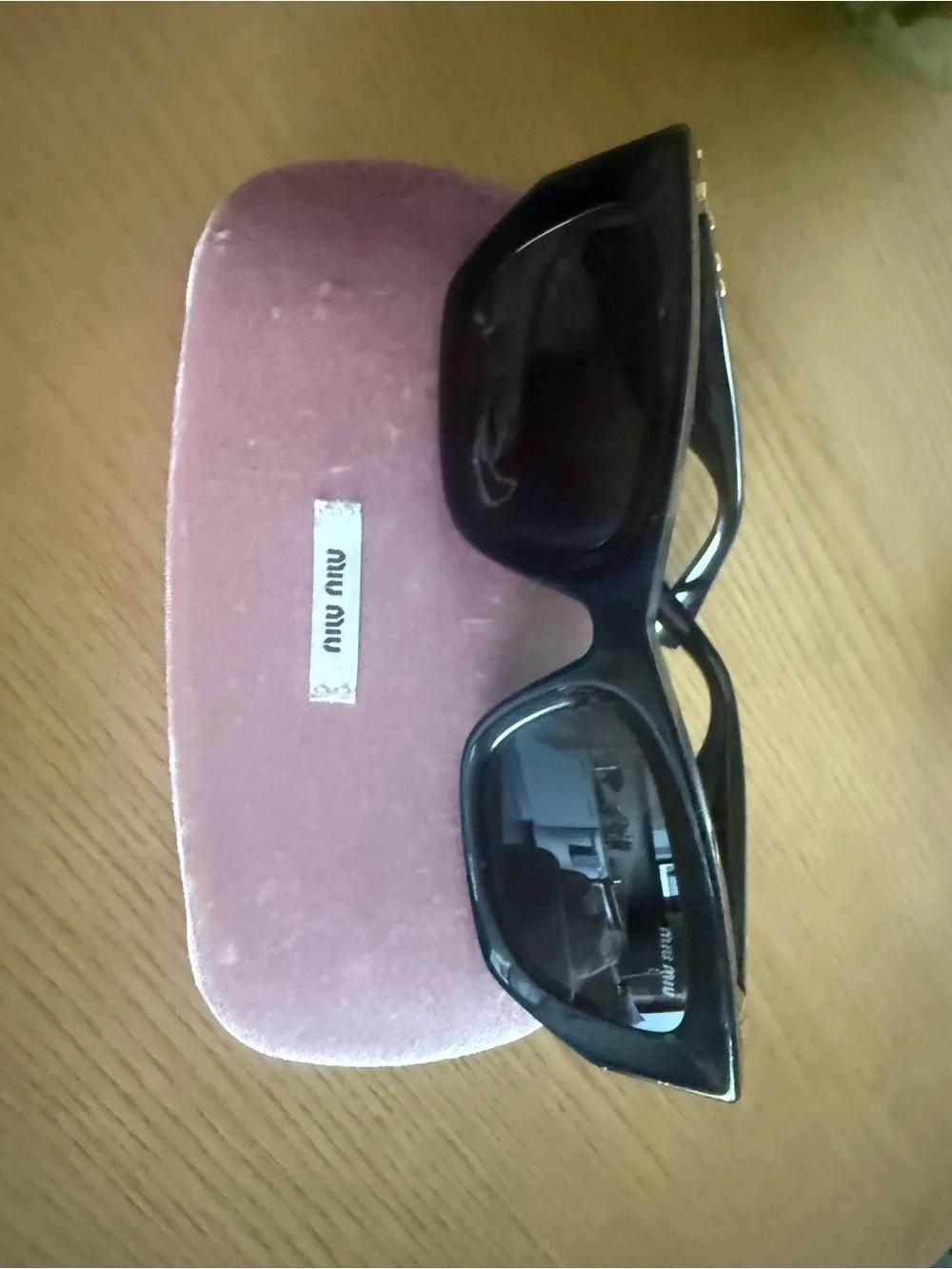 Miu Miu Black Sunglasses with Gold Logo Temples and Pink Velvet Case